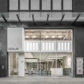 灰白色工業(yè)風(fēng)辦公室裝修設(shè)計灰白色外立面門頭形象效果圖